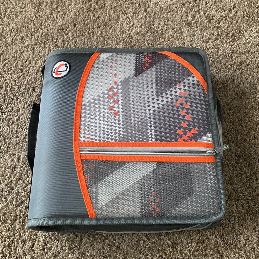 This is a case it binder perfect for holding papers that is orange and gray